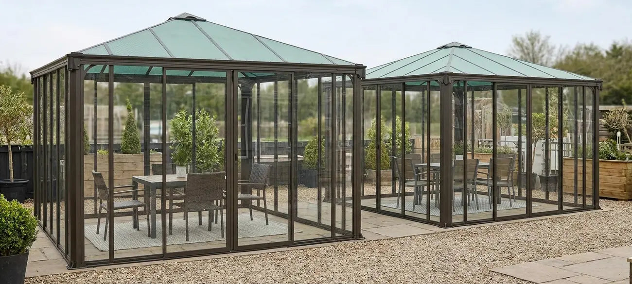 Enclosed garden gazebos with clear panel walls on display