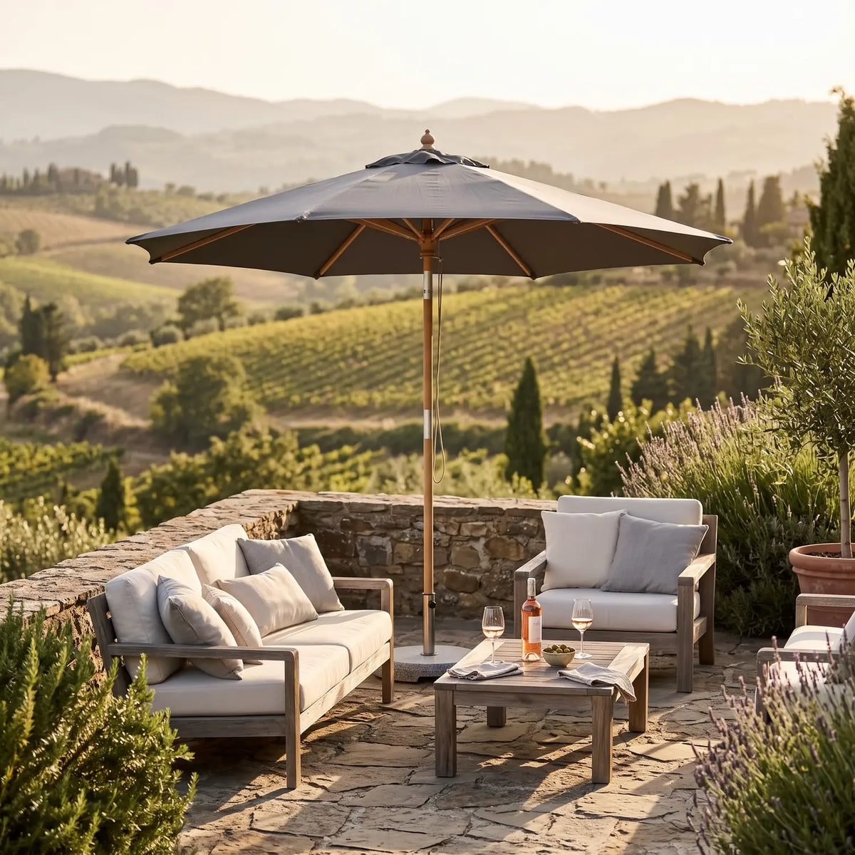Geneve Parasol Ø2.5 m in Grey shading an outdoor lounge group above vineyards